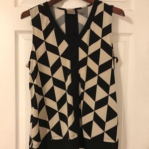 Sleeveless black and white geometric blouse